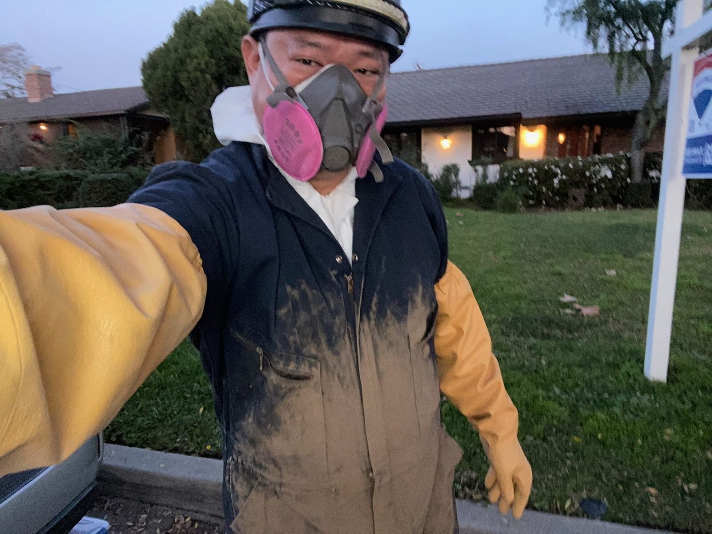 John Suh in full safety gear before a roof and attic evaluation
